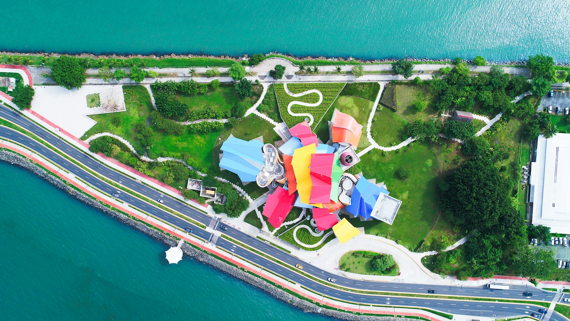Aerial view of the Biomuseo along the Amador Causeway in Panama City, with its colourful roof overlooking the Pacific