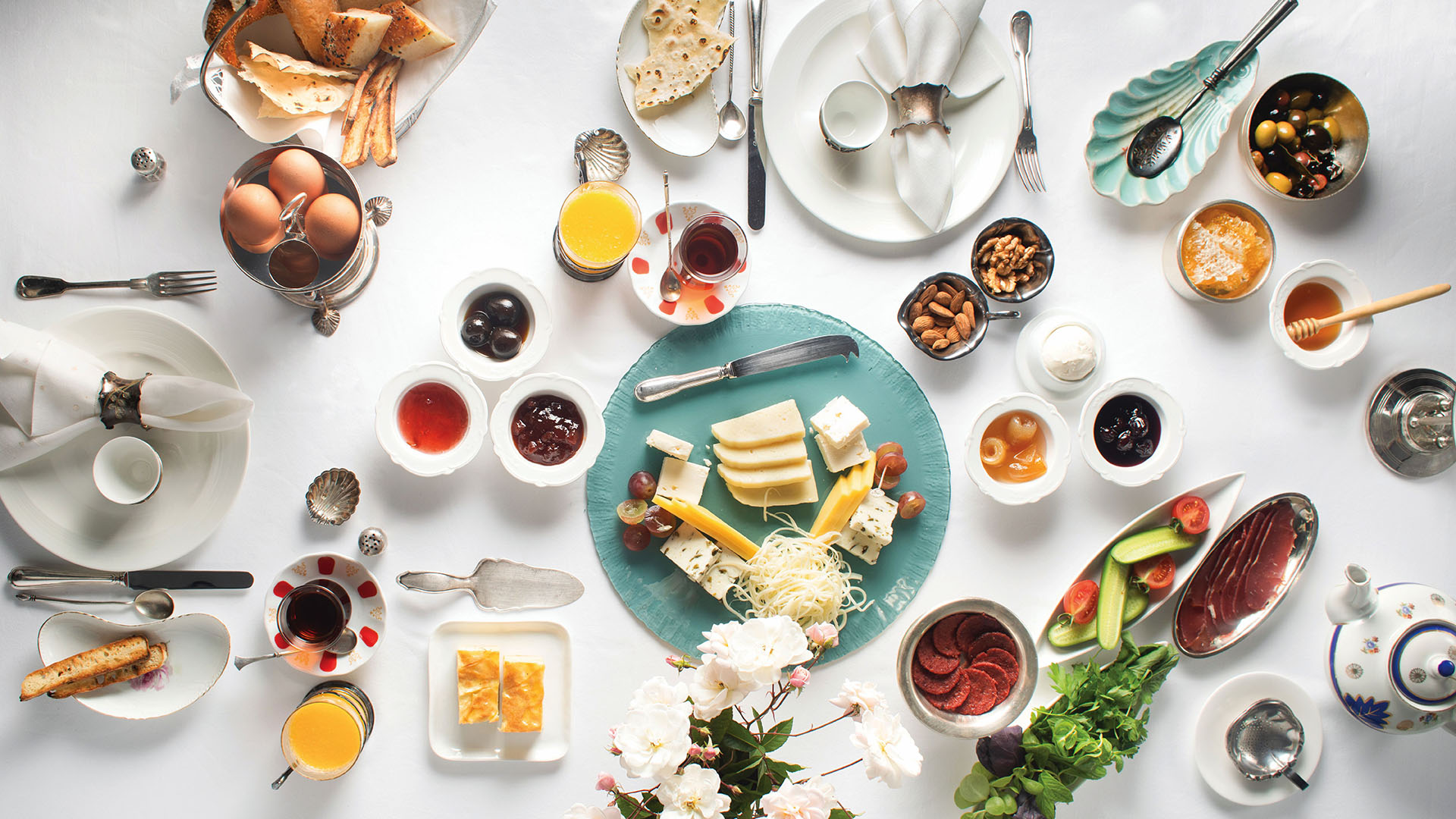 Vibrant Turkish breakfast spread with hot black tea in tulip-shaped glasses / Credit: TGA